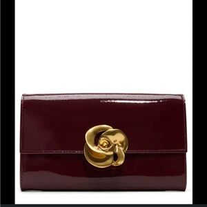 Ted Baker London Maroon Clutch with Gold Floral Detail